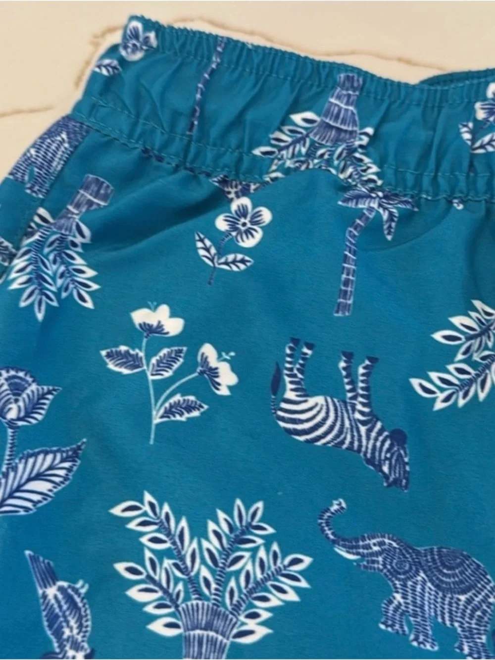 Janie and Jack Teal World Love Swim Trunks with Animal Print